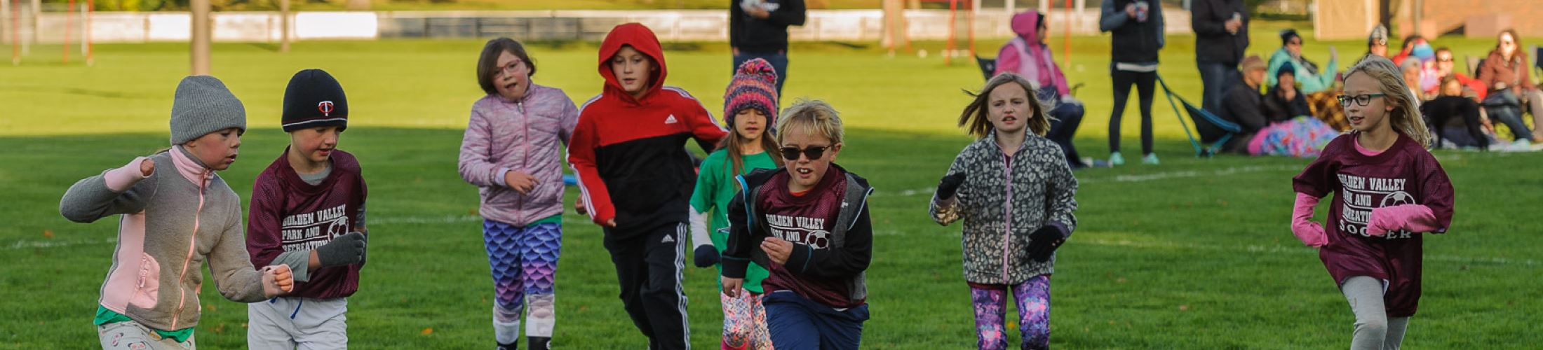 Group of young kids playing soccer