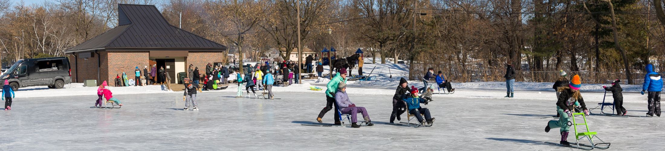 Large group of people doing different activities on ice