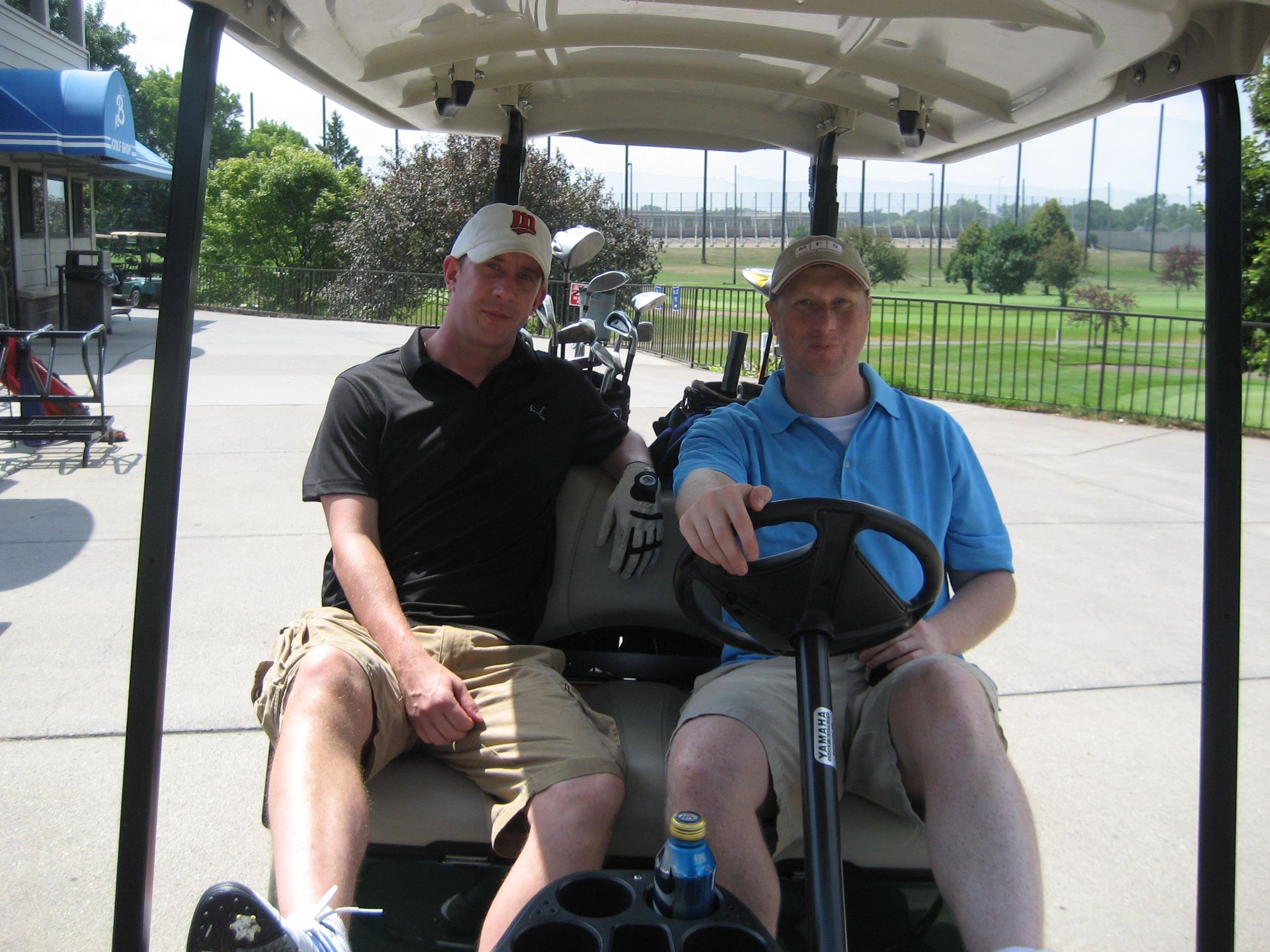 Golfers Sitting in Their Cart